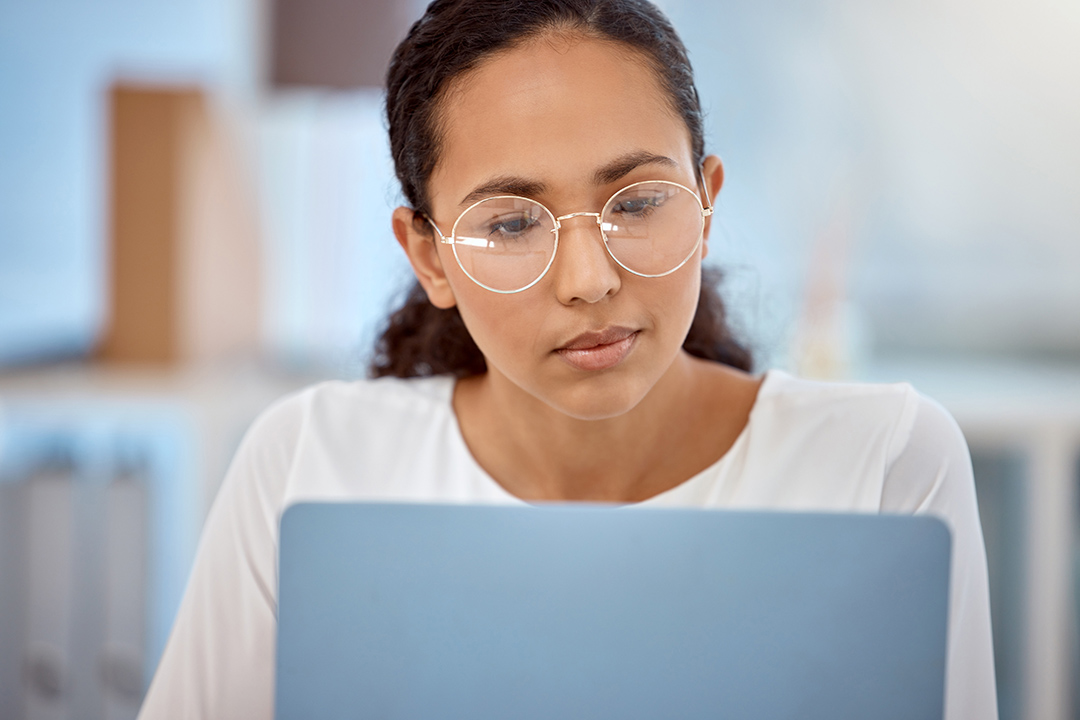 Woman looking at laptop